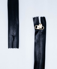 Plastic zipper with invisible fixed chain with metal slider