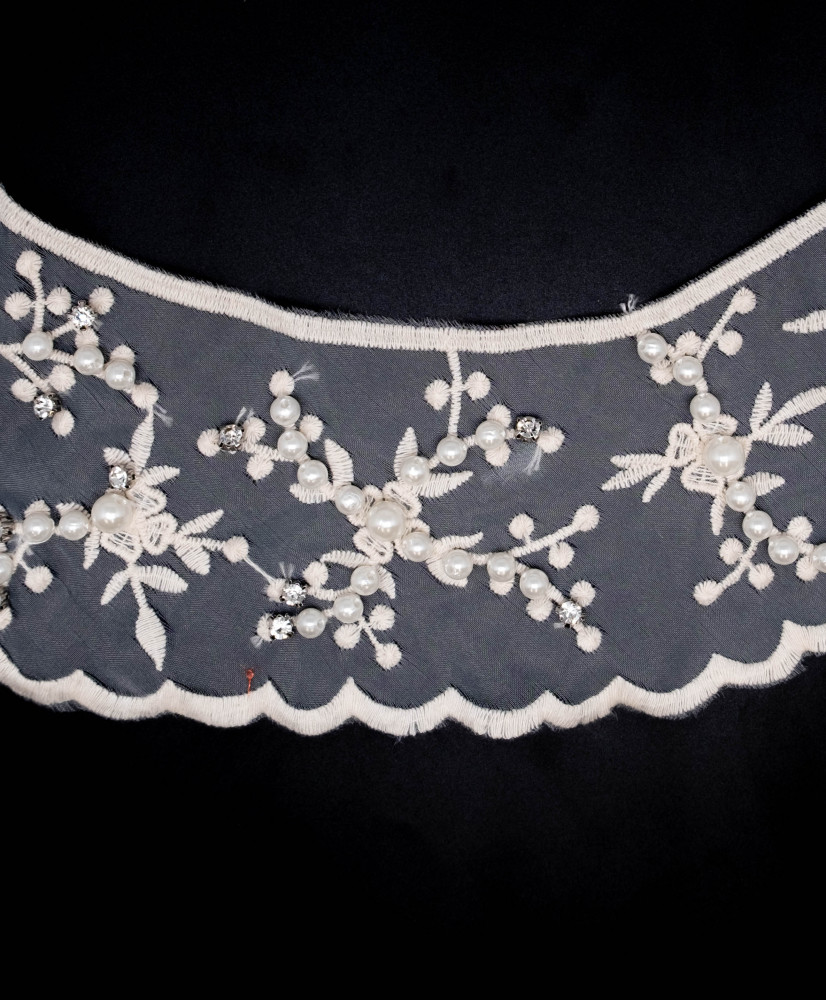 Embroidered neckline with pearls